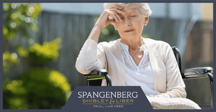 upset elderly woman in a wheelchair