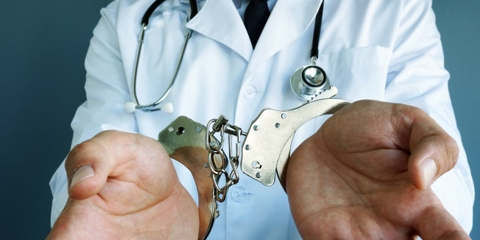 doctor in handcuffs