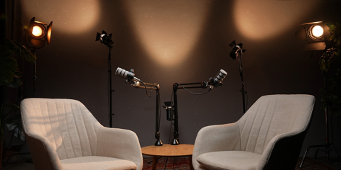 Two Empty Chairs With Microphones and Lights