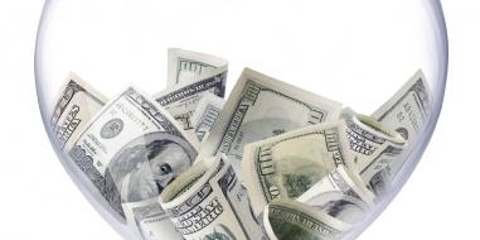 hour glass with cash at the top