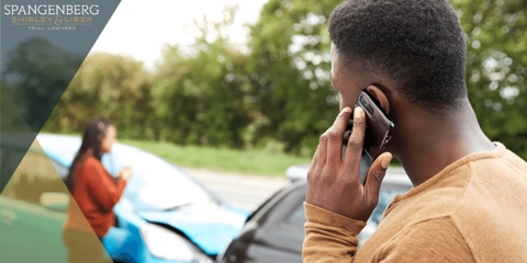 man on the phone after a car accident