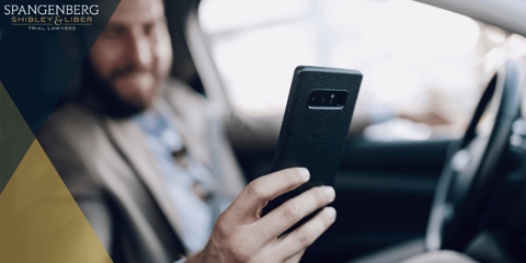 man on his phone while driving