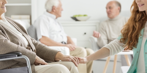 woman in wheelchair in nursing home