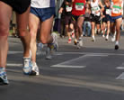 Runners on Pavement Shown From Waist Down