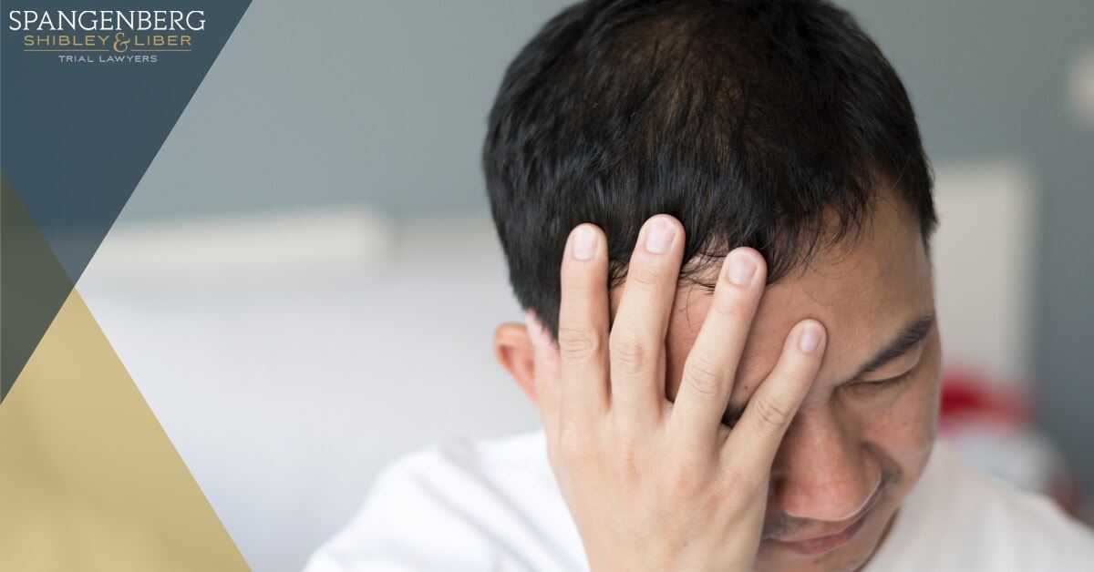 man holding his head