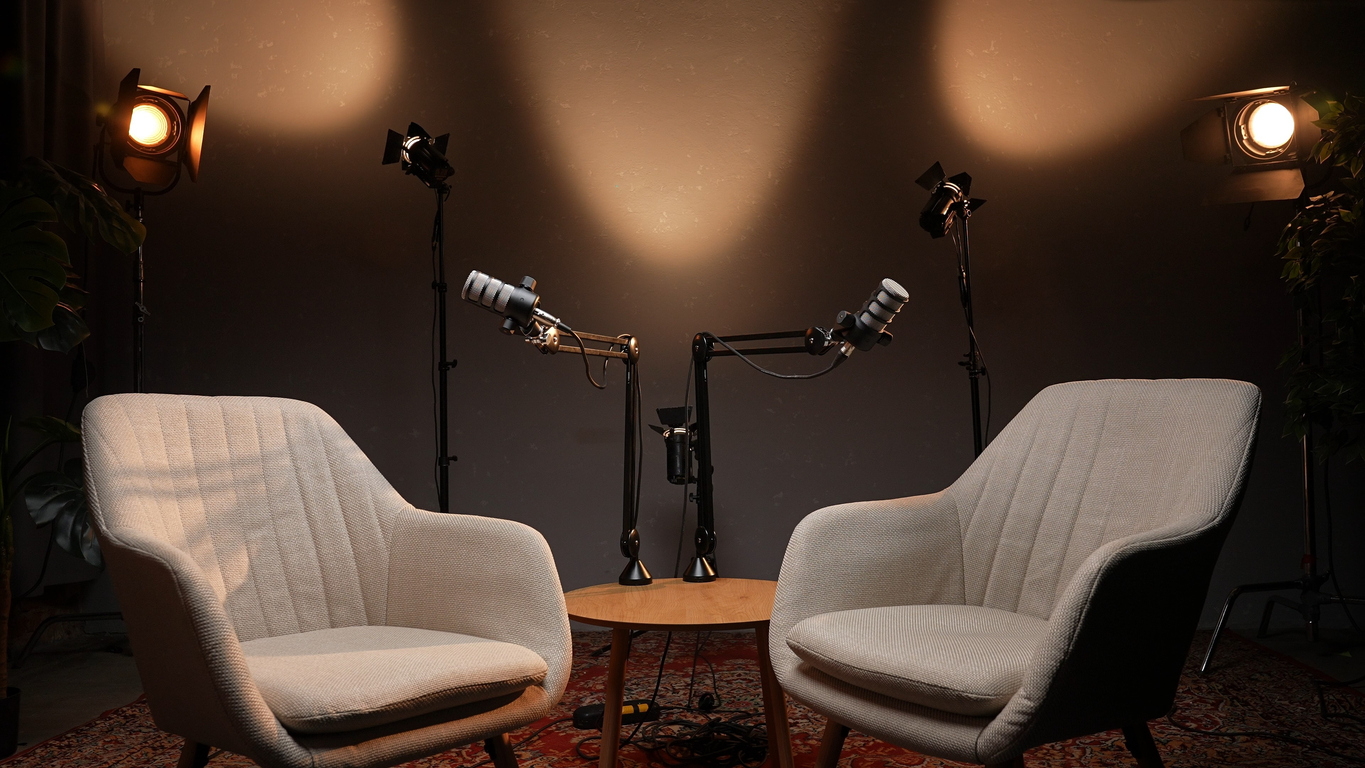 Two Empty Chairs With Microphones and Lights