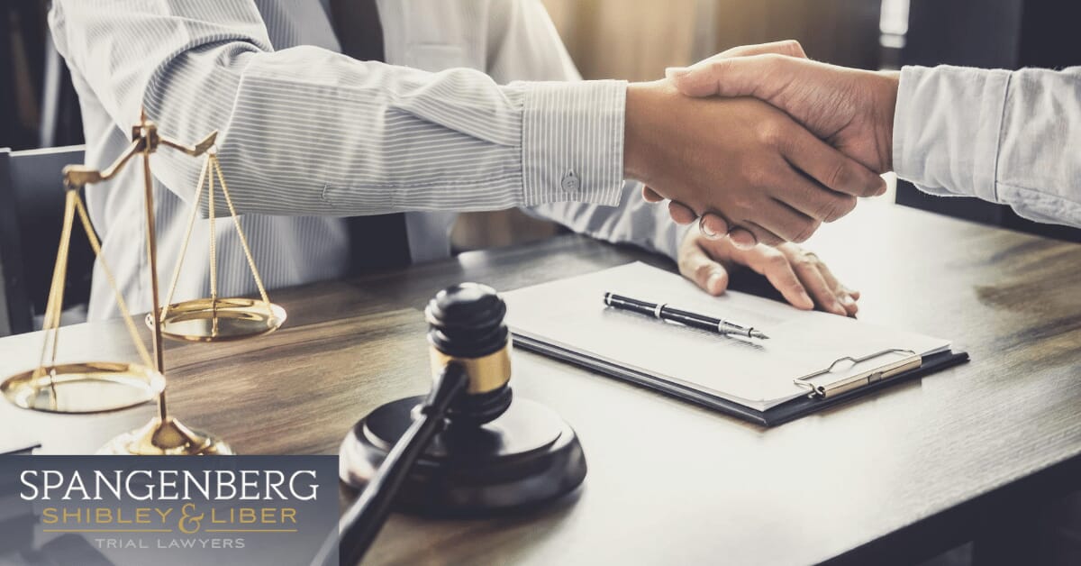 lawyer shaking hands with a client